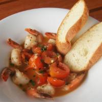 Spicy Prawns · Sautéed prawns with chili flake, wine, tomatoes, butter, toasted bread. Gluten free without ...