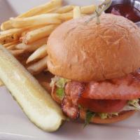 Grilled Alaska Salmon Sandwich · Green goddess, bacon, romaine lettuce, tomato, fries.