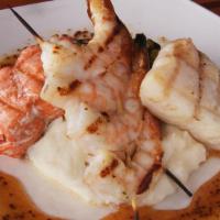 Grilled Mixed Trio · Alaska halibut, salmon, prawns, seeded mustard-honey sauce, Brussels sprouts, sour cream mas...
