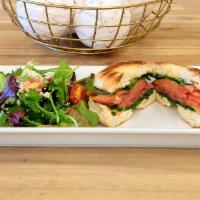 Smoked Salmon Bagel · Smoked Salmon, Cream Cheese, Dill, Onions, Spinach, and Capers.