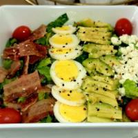 Cobb Salad · Iceberg lettuce, avocado, tomatoes cherry, blue cheese, bacon, hard-boiled eggs, and ranch d...