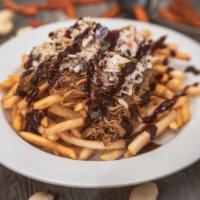 Pulled Pork Fries · with Blackberry Ancho Sauce and coleslaw.