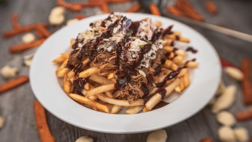 Pulled Pork Fries · with Blackberry Ancho Sauce and coleslaw.