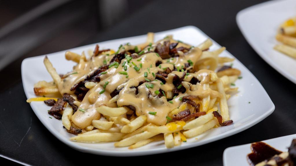 Bacon Cheddar Fries · with Cheese Sauce.