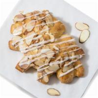 Pastries|Almond Bear Claw · Our flakey, buttery croissant topped with sliced almonds. 500 Calories