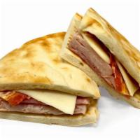 Sandwiches & Wraps|Turkey & Ham Flatbread Club Sandwich · A flatbread club sandwich with turkey, ham, bacon, lettuce, & American cheese. Mayo and must...