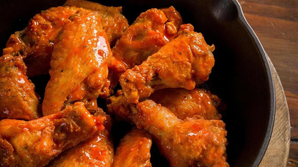 The Rock Wings · Skillet baked and tossed with your choice of ranch season dry rub, hot sauce, sweet red chili sauce or BBQ sauce