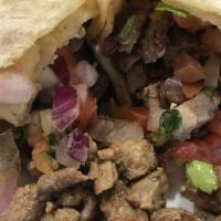 Carne Asada Burrito · Carne asada and pico de gallo.