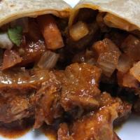 Al Pastor Burrito · Pork, onion and pineapple marinated on a red sauce, with pico de gallo.