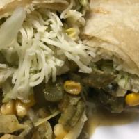 Rajas Con Crema Burrito · Sliced poblano peppers cooked with butter, sour cream, corn and onions. Lettuce and cheese.
