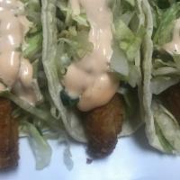 Fish Taco · Fried fish, lettuce, home made dressing.