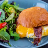 *Brekkie Sandwich · Two sunny-side up farm eggs, applewood smoked bacon, cheddar cheese, kosho aioli, house hawa...