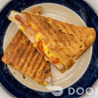 Ham And Cheese Panini · Honey ham with honey mustard, tomatoes & cheddar cheese grilled on seasoned focaccia bread.