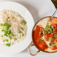 Butter Chicken · Pieces of chicken, first seared in the tandoori oven then braised in a tomato cream sauce.