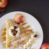Apple Cinnamon Crepe · This delicious crepe is full of our cooked apple cinnamon filling, topped with a caramel sau...