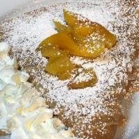 Peach Crepe · This delicious crepe is full of chopped peaches, topped with our leche sauce.