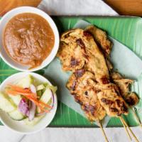 Chicken Satay · Grilled marinated chicken on skewers served with a classic peanut sauce and sweet and sour c...