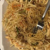 Singapore Noodles · Angel hair rice noodles stir-fried with shrimp, bbq pork, bean sprouts, scallions and a touc...