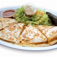 Quesadillas · Flour tortilla filled with cheese and your choice of steak or chicken. It also comes with le...
