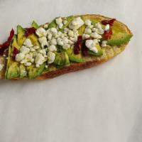 Avo Toast · Sour dough toasted with avocado, feta sundryied tomatoes and fresh olive oil