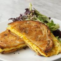 Egg + Cheese Melt · Three eggs , cheddar cheese melted on buttered sourdough served  with dressed green salad + ...