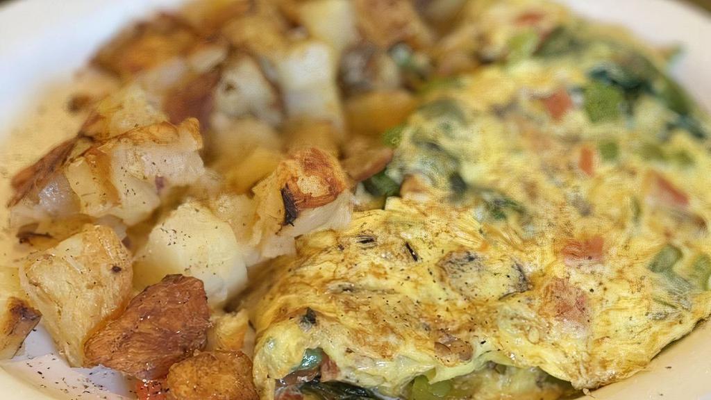 Build An Omelette · Choose any three items. Served with home fries and choice of toast. Add extras for an additional charge.