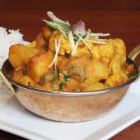 Aloo Gobi · Potatoes and cauliflower cooked with special spices. Served with rice.