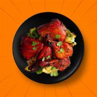 Tandoori Spring Chicken · Six pieces. Spring chicken marinated in a traditional tandoori masala and hung yogurt, skewe...