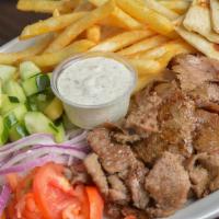 House Special · Lamb and beef or chicken over French fries served with Greek salad, hummus, pita and soda.