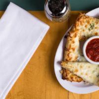 Cheese Bread · Our house Garlic bread with melted Mozzarella served with marinara