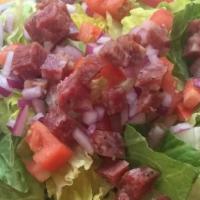 Chopped · Lettuce, tomatoes, onion, salami, chicken, provolone, balsamic vinaigrette.