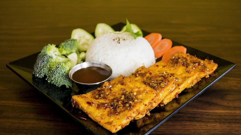 Lemongrass Tofu Rice Bowl · Gluten free. Fresh tofu sautéed in house special sauce, fresh ginger, fresh garlic, served with steamed broccoli, cucumber, steamed carrot, cilantro, and pickled carrot & daikon.