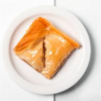 Baklava (Homemade) · Crispy baked layers of sweetened filo dough filled with sweetened walnuts.