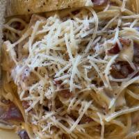 Spaghetti Carbonara · Our creamy parmesan sauce with Proscuitto, onion and cracked black pepper.