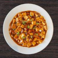 *New* Mapo Tofu · Soft tofu cooked with BBQ pork in garlic chili sauce topped with green onions. Spicy
