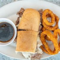 Prime Rib French Dip · Thinly sliced prime rib with swiss cheese and au jus on a hoagie.