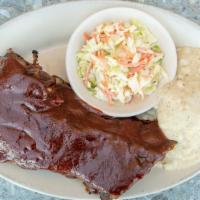 Half Rack Baby Back Pork Ribs · Cooked with red wine vinegar and grilled with Kansas City bbq sauce.