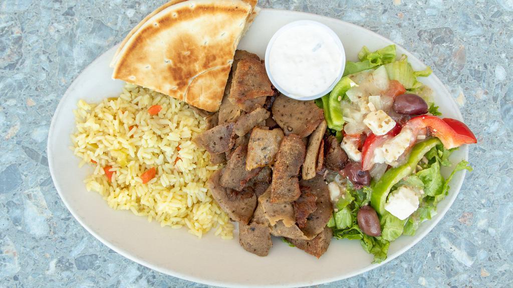Gyro Platter · Gyro meat with Greek rice, Greek salad, pita bread, and tzatziki sauce.