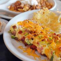 Nice To Meat You Scramble · Three eggs, bacon, sausage, chorizo, and cheddar jack cheese. Served with hash browns and to...