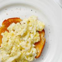 Kids' Scrambled Eggs & Toast · Kids' Scrambled eggs with their choice of meat and toast.