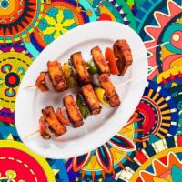 Char Grilled Cottage Cheese Tikka · Fresh cottage cheese cubes marinated in our signature tandoori masala and char grilled in an...