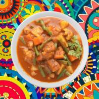 Homestyle Veggie Curry · Fresh seasonal vegetables sautéed to perfection with herbs, ground spices, red onions and pe...