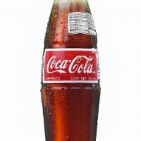 Mexican Coke · Mexican coke, sweetened with sugar cane. (12 oz. bottle)