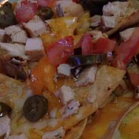 Lucky’S Nachos · Crispy tortilla chips topped with freshly shredded cheese, black olives, jalapeño, tomatoes,...