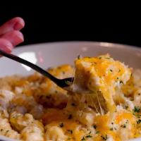 Fiery Mac & Cheese · Creamy mac and cheese made with our fiery feta dip with sausage and corn topped with crispy ...