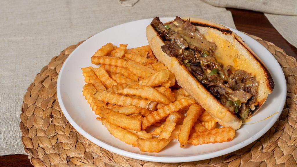 Philly Cheesesteak · Thinly sliced steak grilled with onions and bell peppers topped with Provolone cheese inside of a warm french roll.