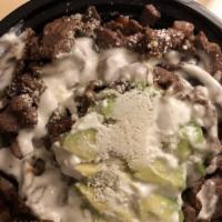 Steak Protein Bowls · With pinto beans, rice, sour cream, avocado & cotija cheese with grilled steak.