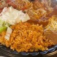 Cheese Enchilada · Smothered in enchilada sauce. Topped with lettuce, tomatoes, cheese, and sour cream. Two per...