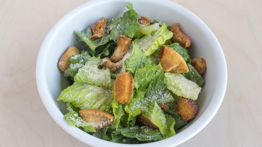 Caesar Salad · Romaine lettuce, parmesan cheese, croutons, and Caesar dressing on the side.