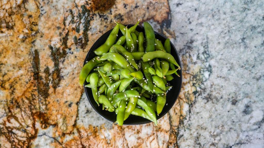 Edamame · Steamed soybeans served with sea salt.